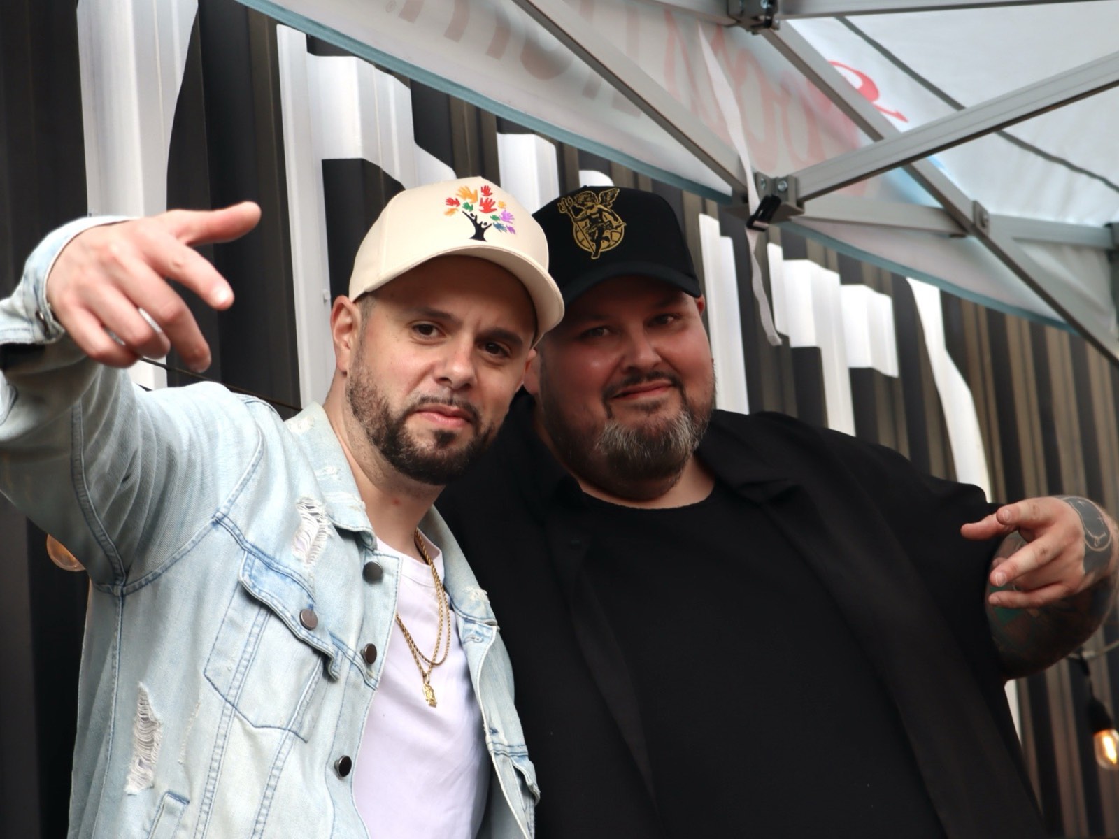 Two friends smiling together at the day party