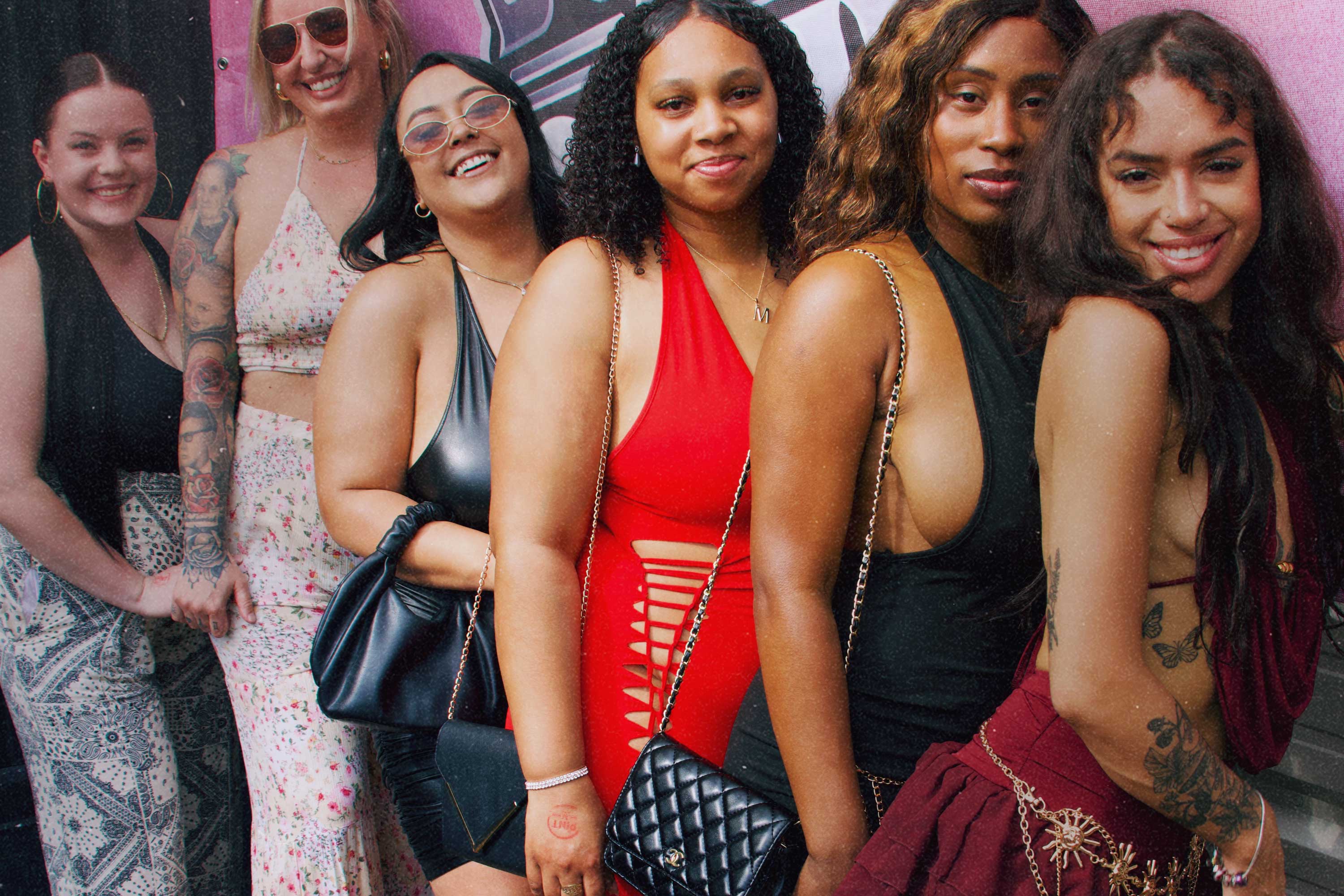 Six friends dressed up in front of a Bump & Grind photo backdrop